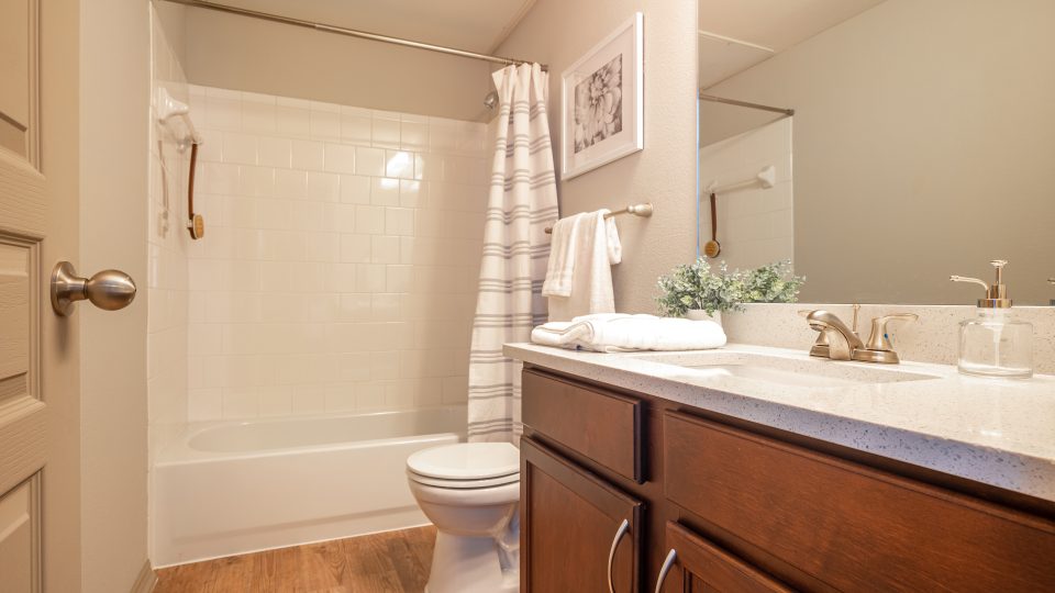 a bathroom with a toilet, sink and bathtub at The  Wyatt at Presidio Junction