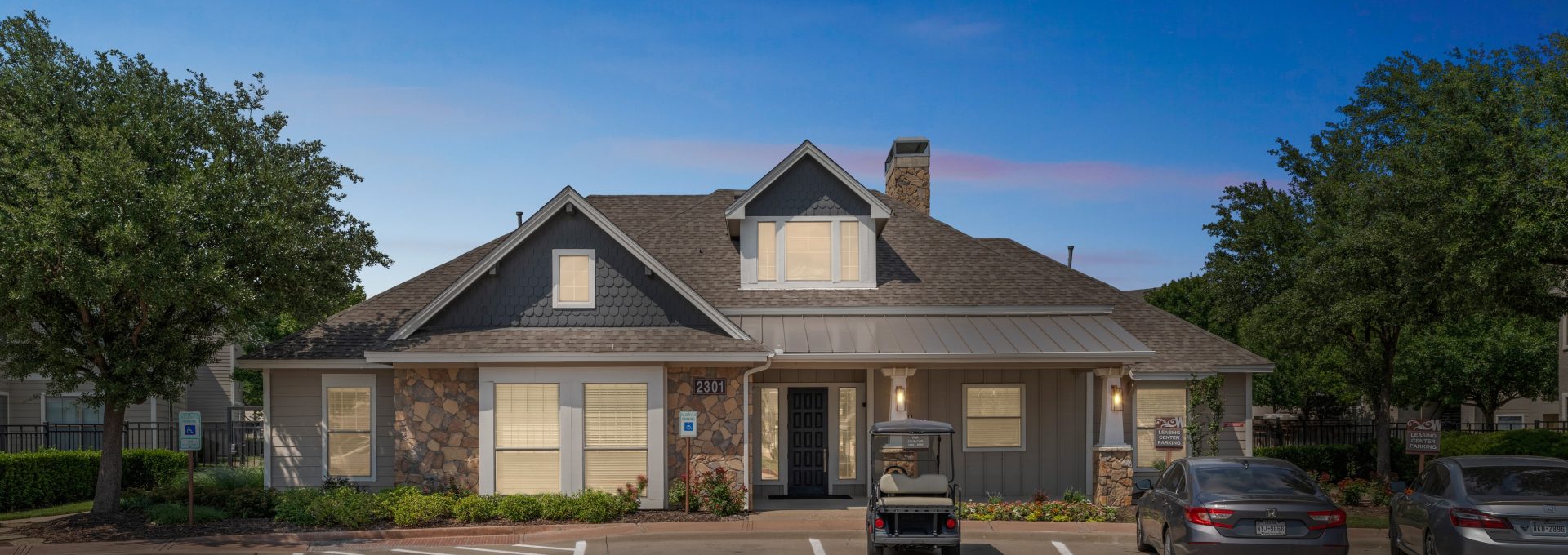 the front of a home with a parking lot and a car at The  Wyatt at Presidio Junction