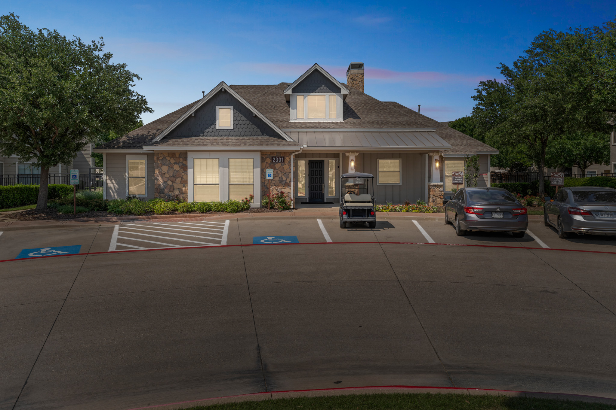 the front of a home with parking lot and cars at The  Wyatt at Presidio Junction