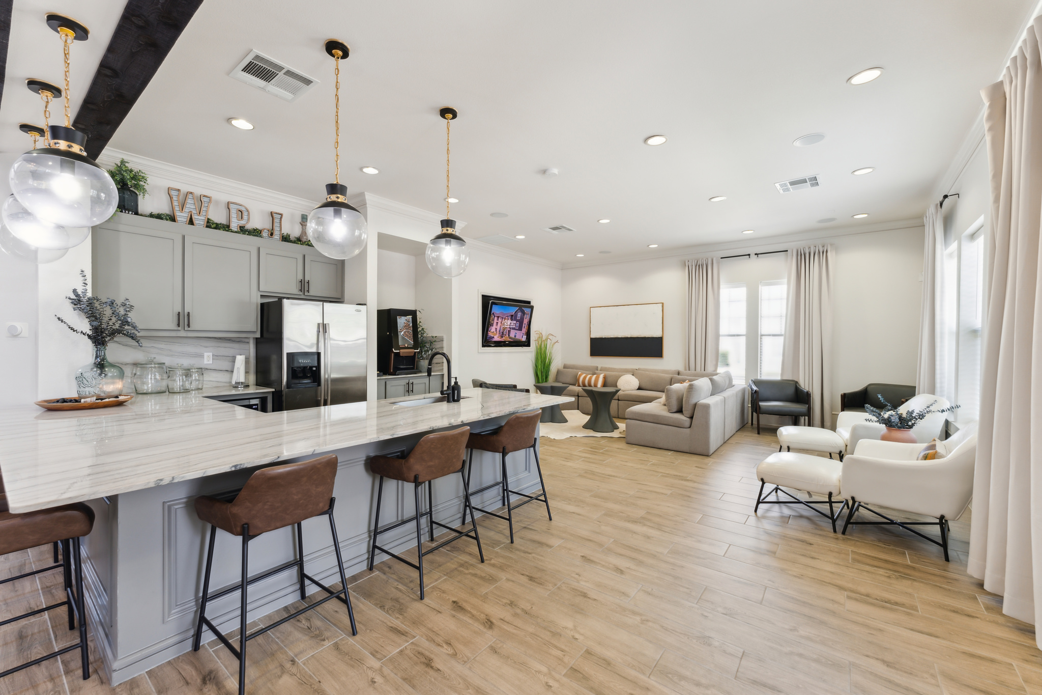 a large open kitchen with a large island and bar at The  Wyatt at Presidio Junction