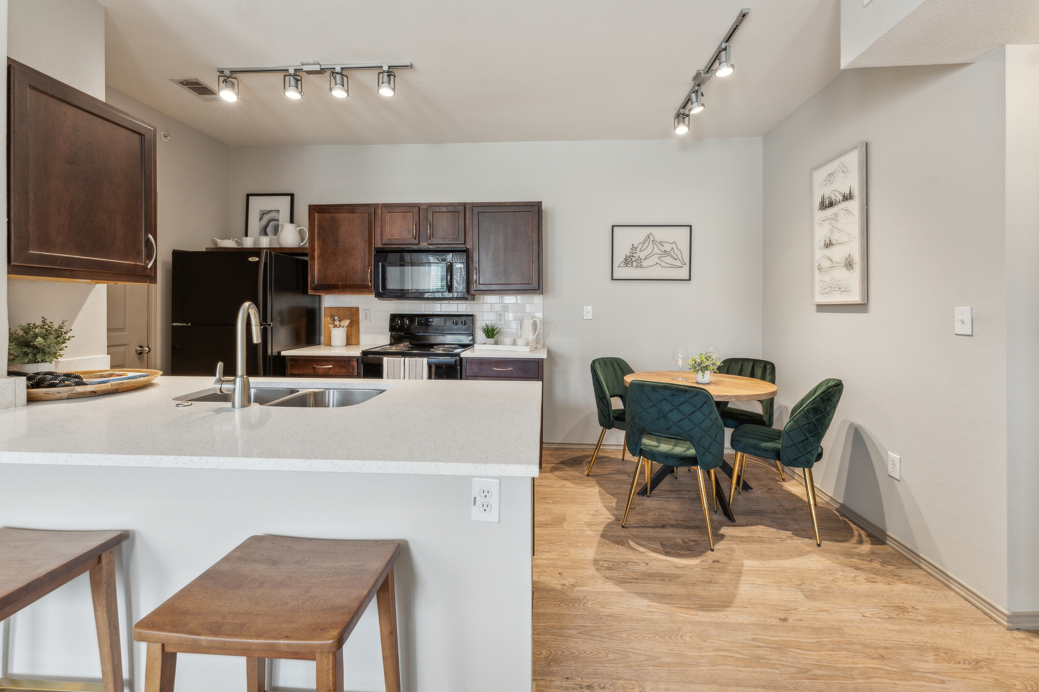 a kitchen with a dining table and chairs at The  Wyatt at Presidio Junction
