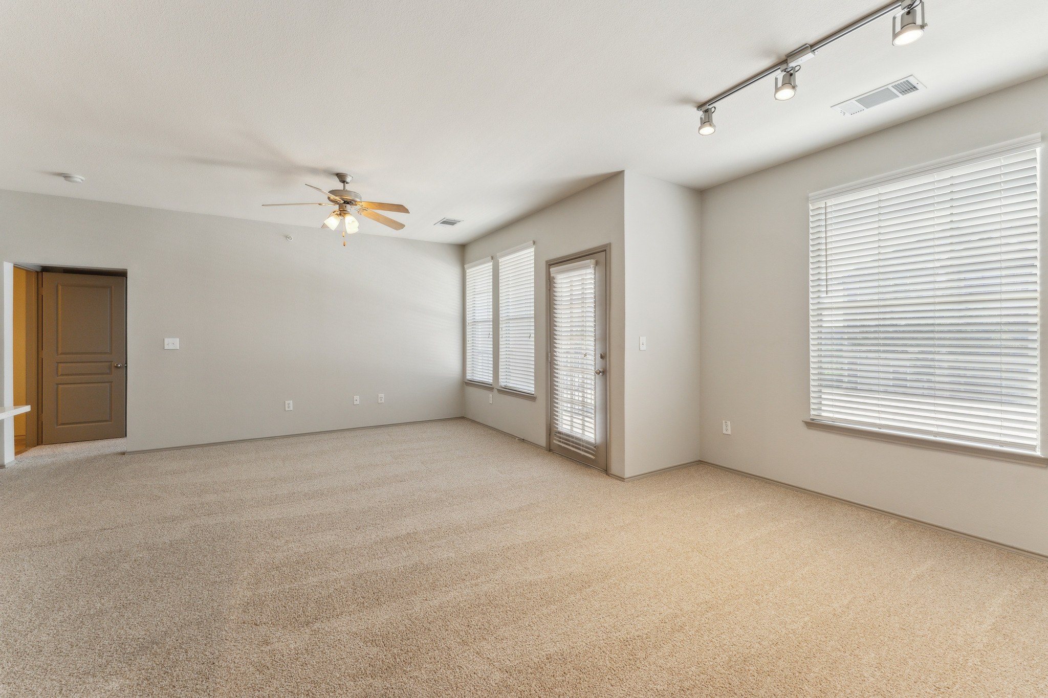 empty room with carpet and ceiling fan at The  Wyatt at Presidio Junction