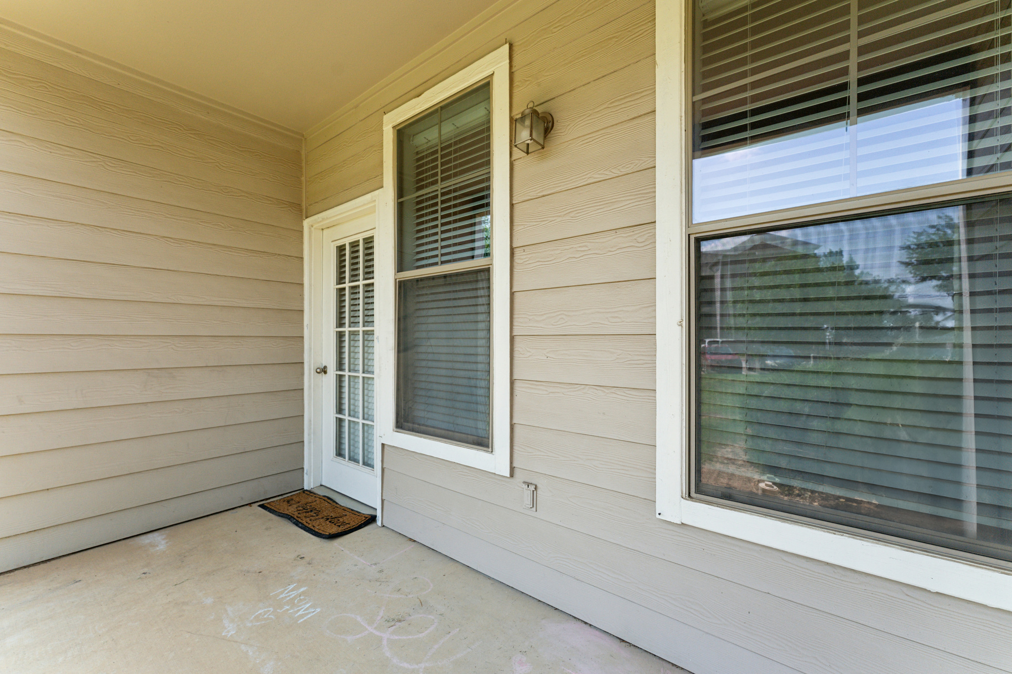 a porch with a door and windows at The  Wyatt at Presidio Junction
